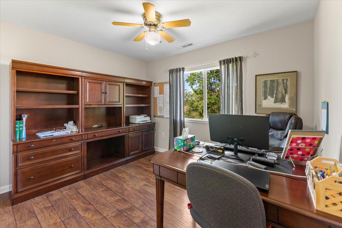 20410 Mallorca Lane Red Bluff, CA 96080 - Photo 20 of 37 a reading room with wooden floor and furniture