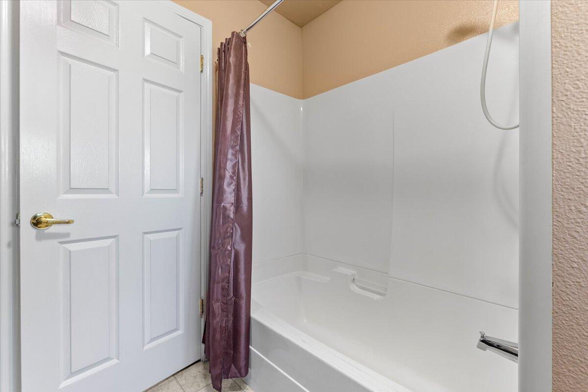 20410 Mallorca Lane Red Bluff, CA 96080 - Photo 22 of 37 a bathroom with a shower