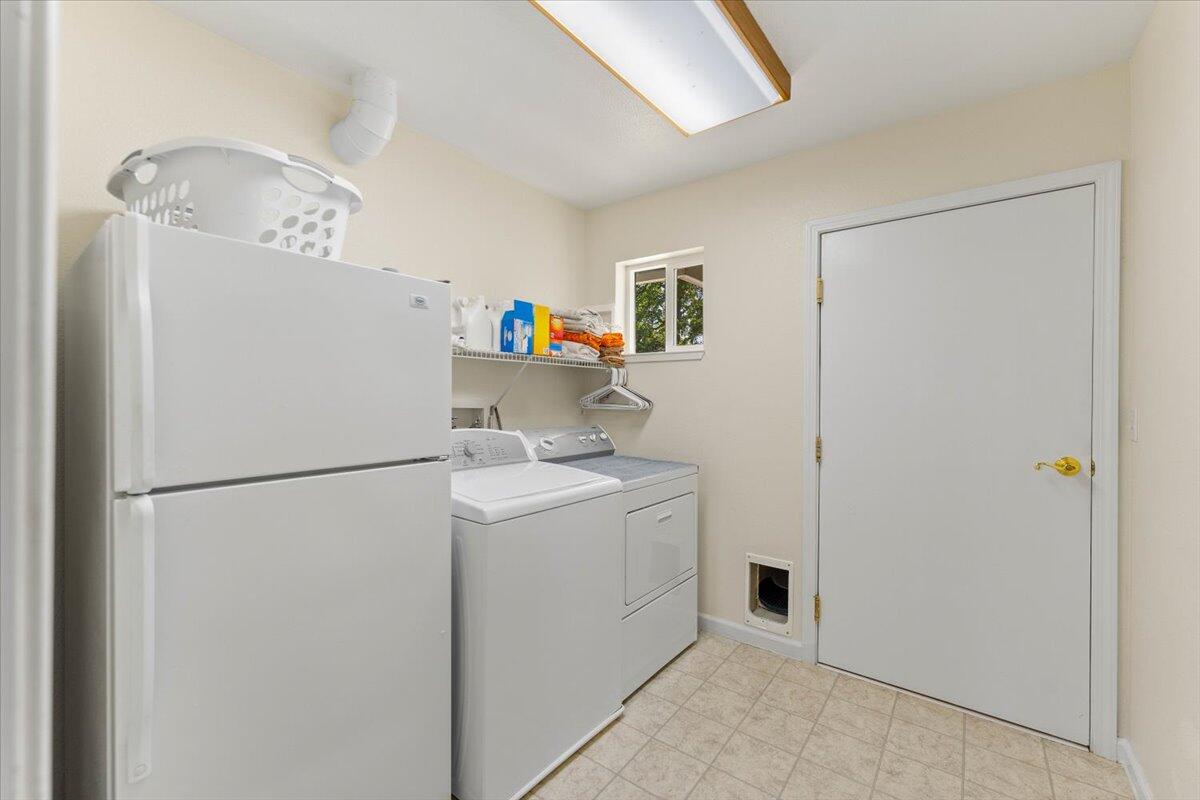 20410 Mallorca Lane Red Bluff, CA 96080 - Photo 23 of 37 a utility room with dryer and washer