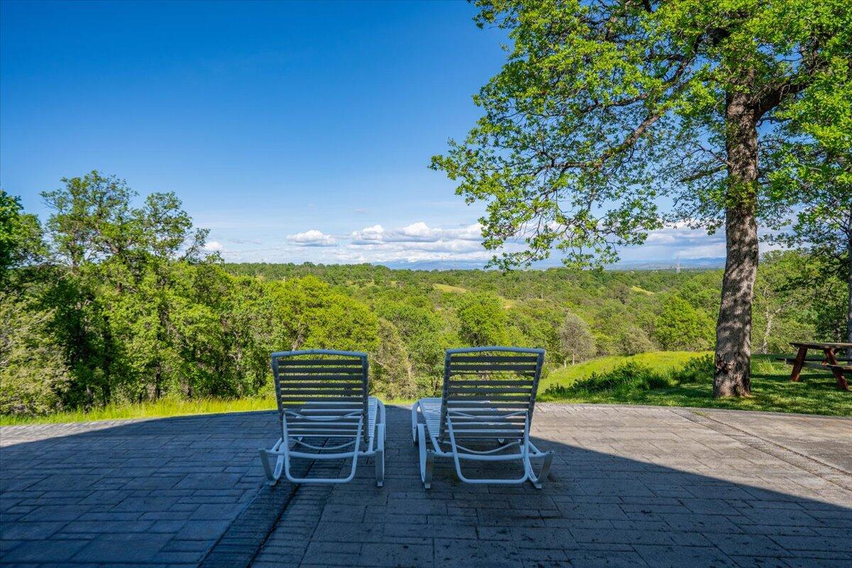 20410 Mallorca Lane Red Bluff, CA 96080 - Photo 32 of 37 a view of a chairs and table on the wooden floor