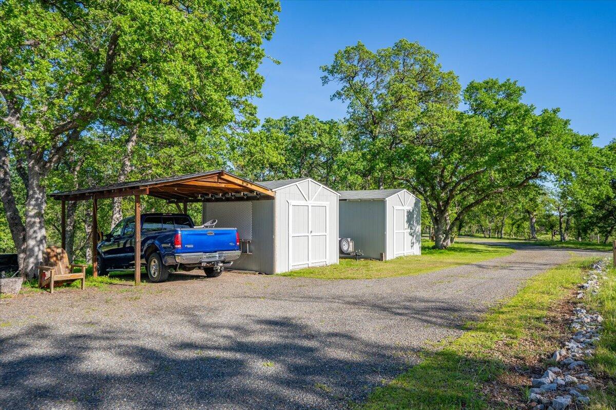20410 Mallorca Lane Red Bluff, CA 96080 - Photo 33 of 37 a view of street and car parked in the yard