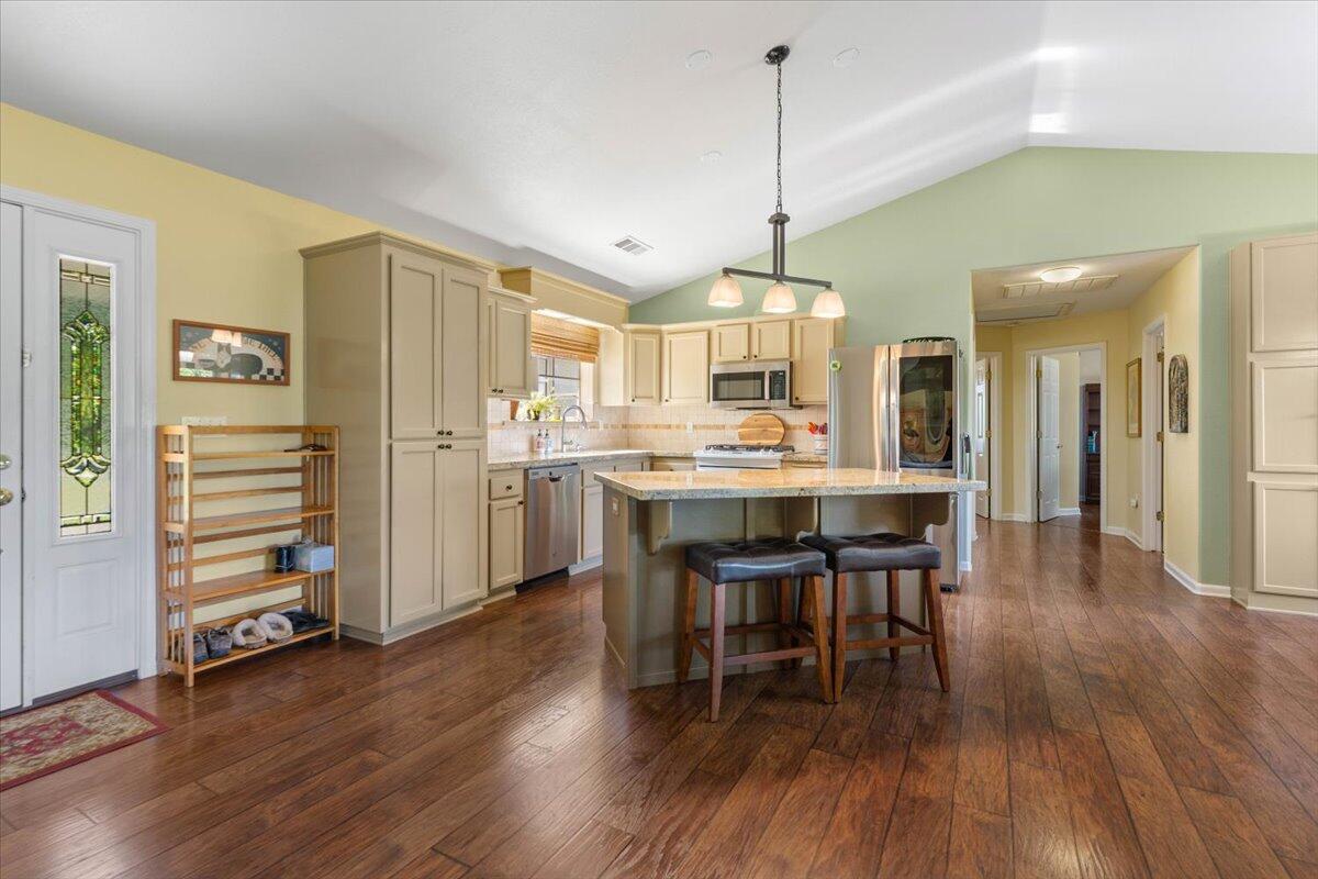 20410 Mallorca Lane Red Bluff, CA 96080 - Photo 4 of 37 a large kitchen with a table and chairs