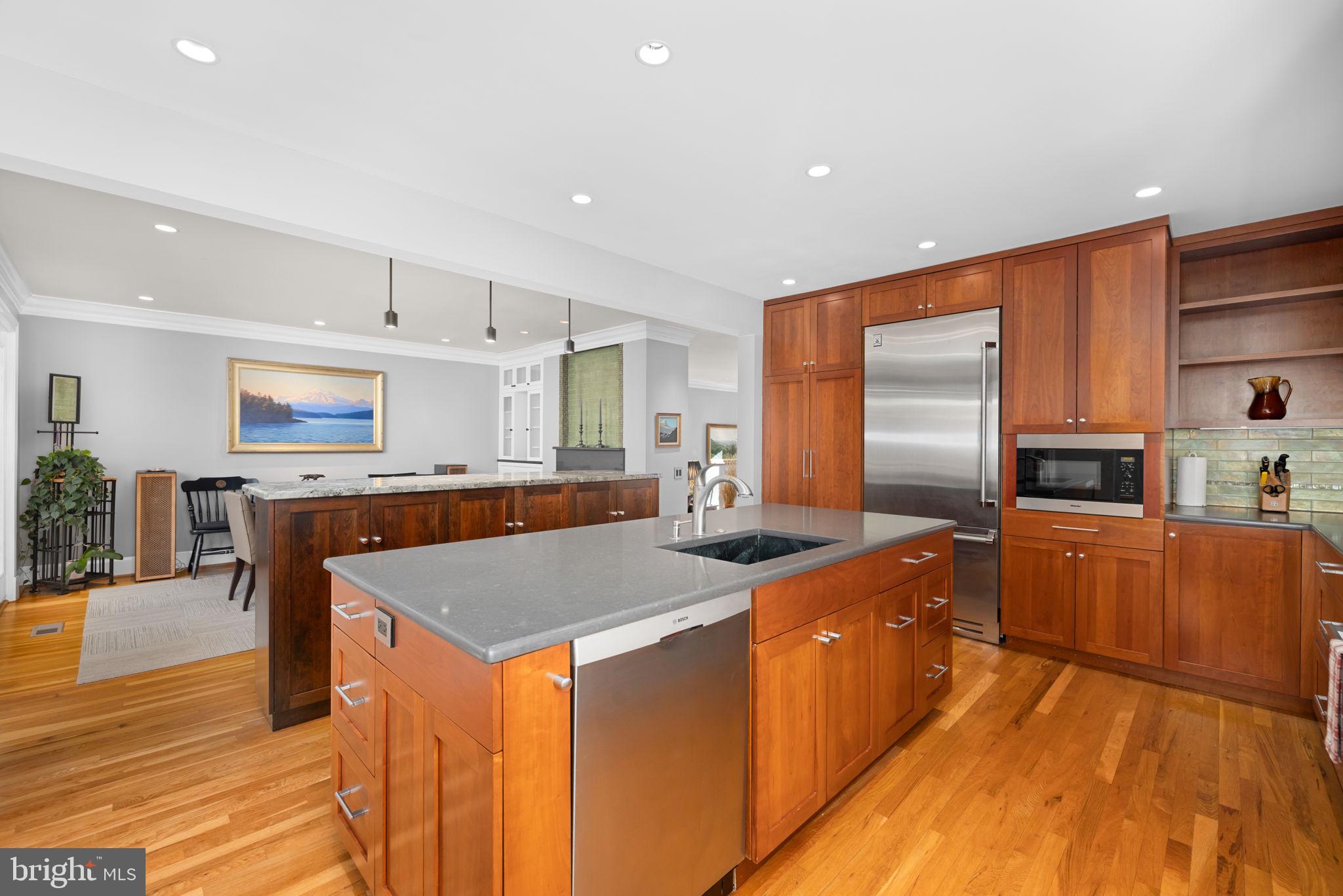 3988 Georgetown Court Northwest Washington, DC 20007 - Photo 14 of 38 a kitchen with stainless steel appliances granite countertop a refrigerator a stove and a wooden floors
