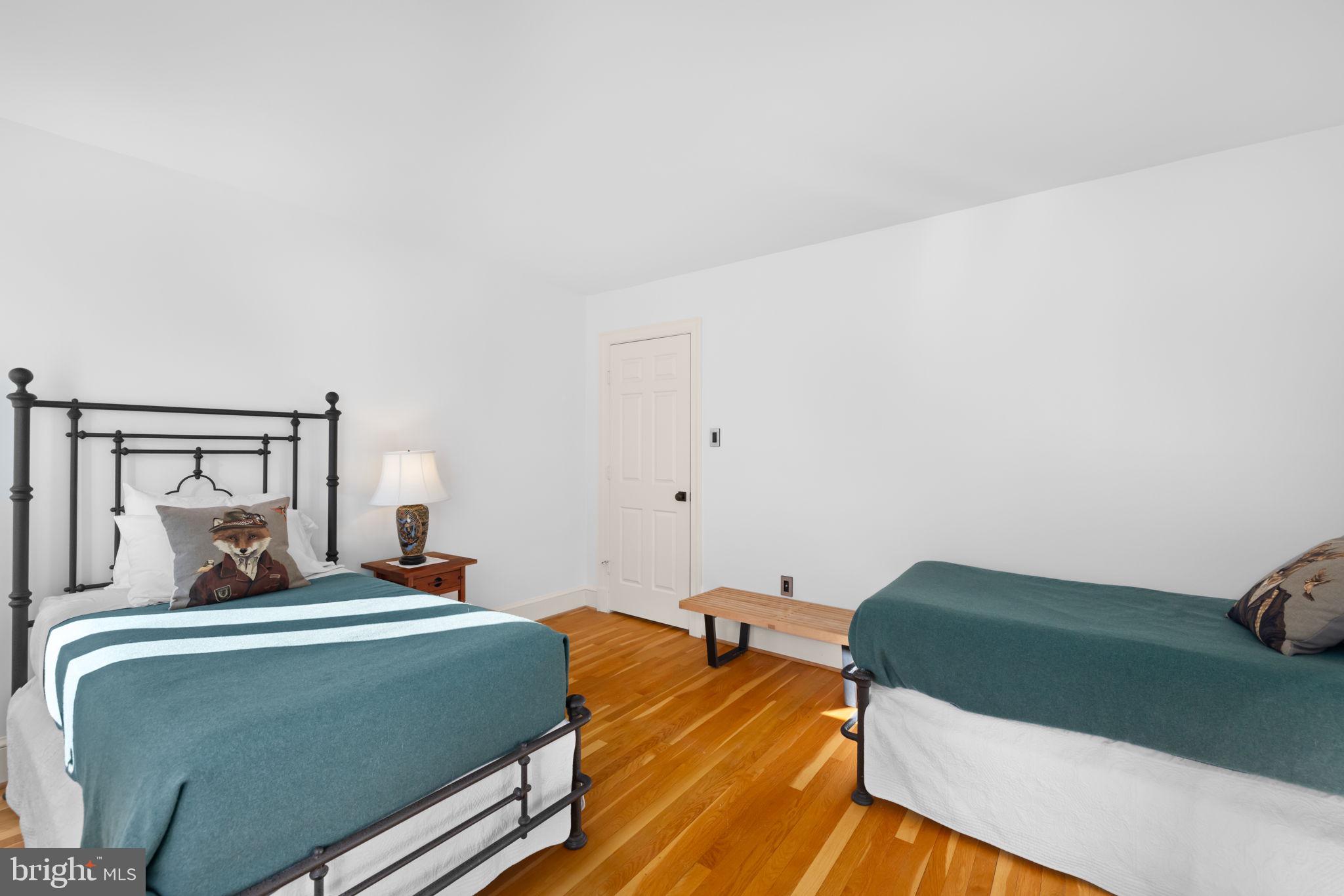 3988 Georgetown Court Northwest Washington, DC 20007 - Photo 21 of 38 a bedroom with a bed and wooden floor