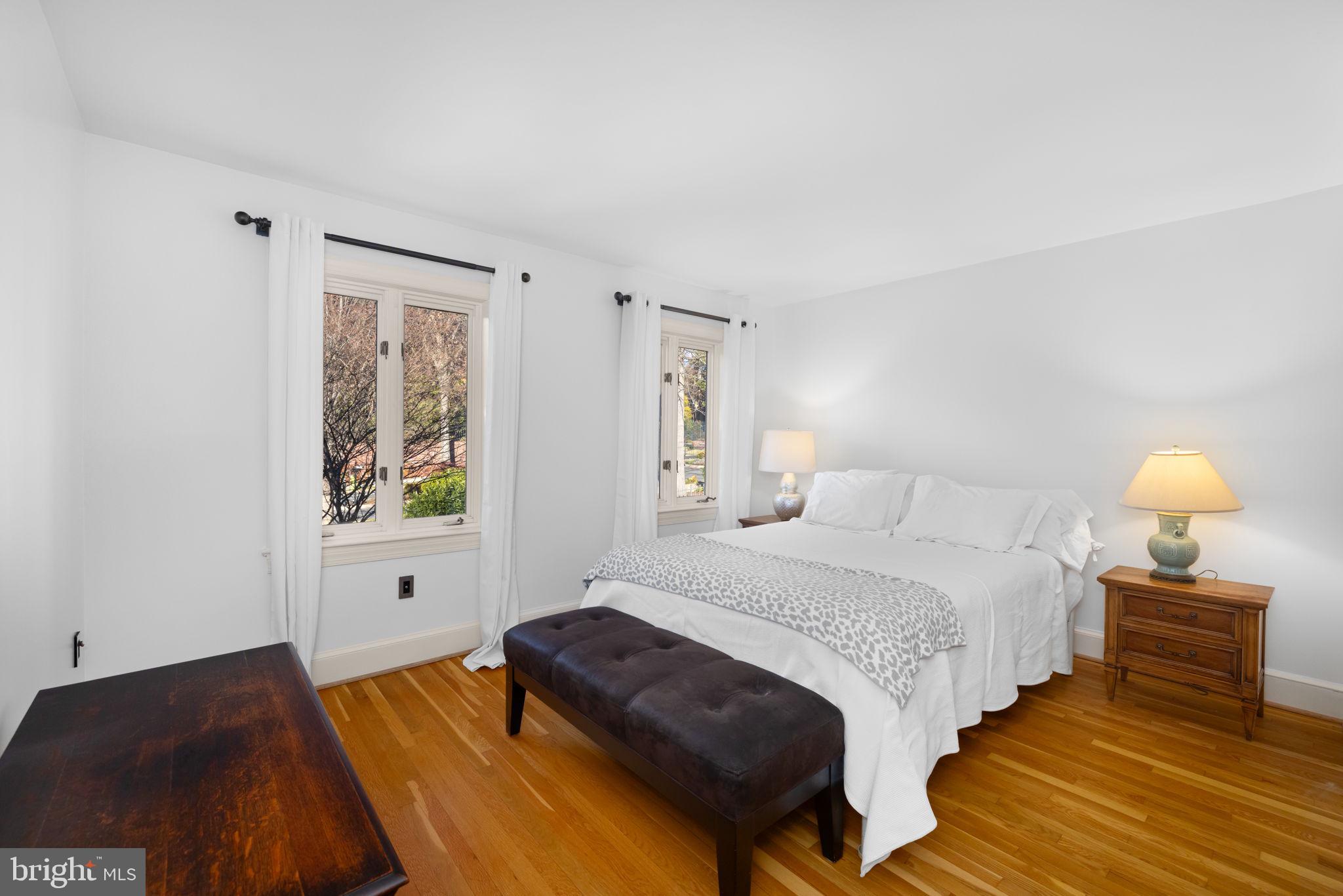 3988 Georgetown Court Northwest Washington, DC 20007 - Photo 23 of 38 a bedroom with a bed and a lamp on dresser
