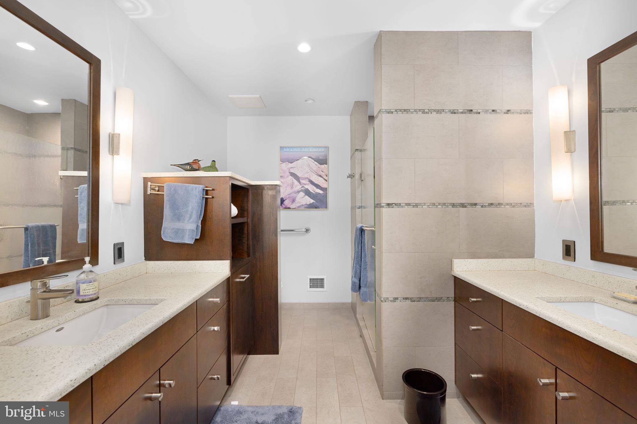 3988 Georgetown Court Northwest Washington, DC 20007 - Photo 25 of 38 a bathroom with a sink vanity granite tub and shower