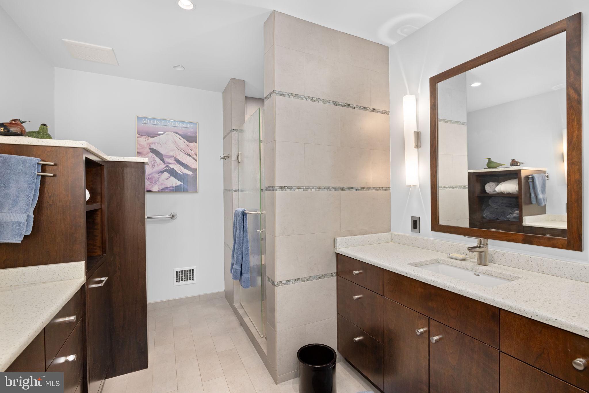 3988 Georgetown Court Northwest Washington, DC 20007 - Photo 26 of 38 a bathroom with a sink double vanity and a mirror