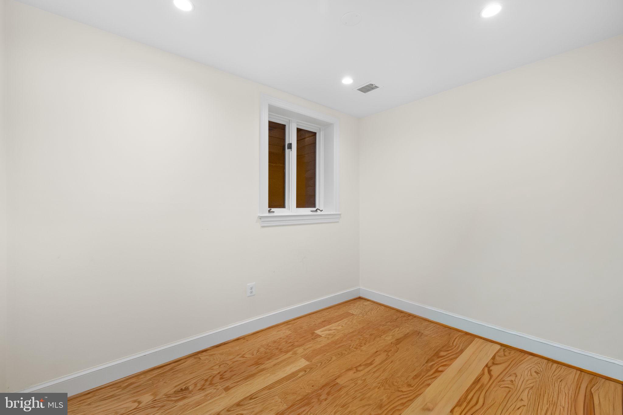 3988 Georgetown Court Northwest Washington, DC 20007 - Photo 29 of 38 a view of empty room with wooden floor