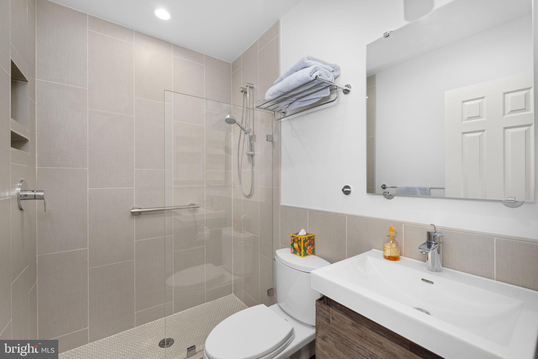 3988 Georgetown Court Northwest Washington, DC 20007 - Photo 31 of 38 a bathroom with a sink toilet and shower