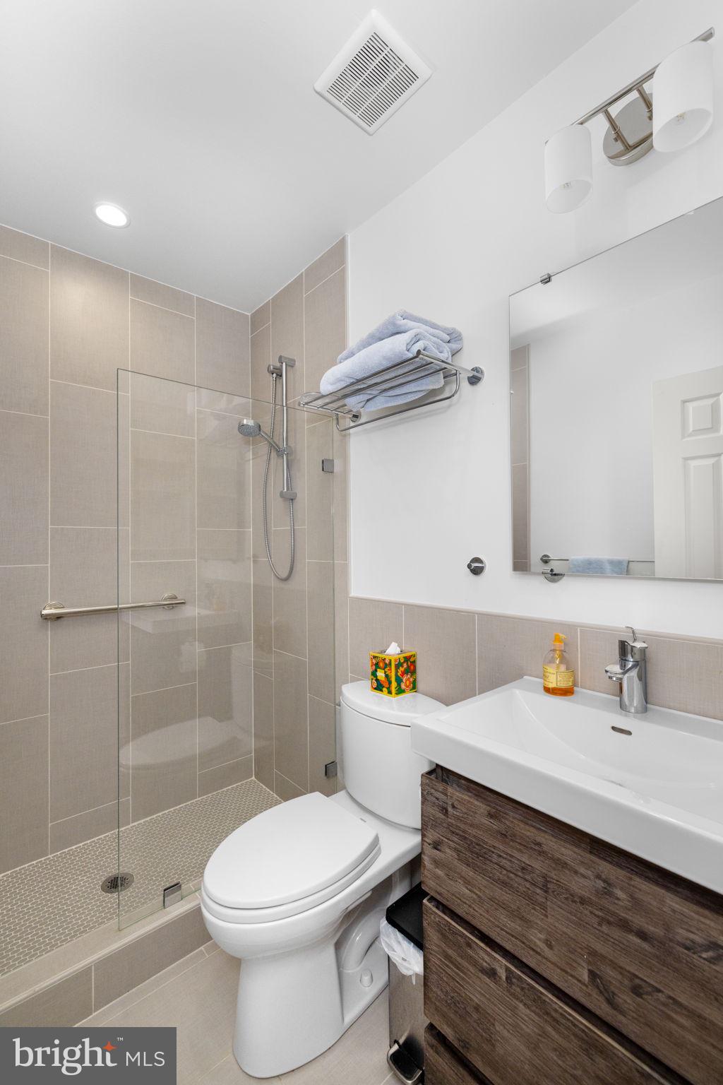 3988 Georgetown Court Northwest Washington, DC 20007 - Photo 32 of 38 a bathroom with a sink toilet and shower