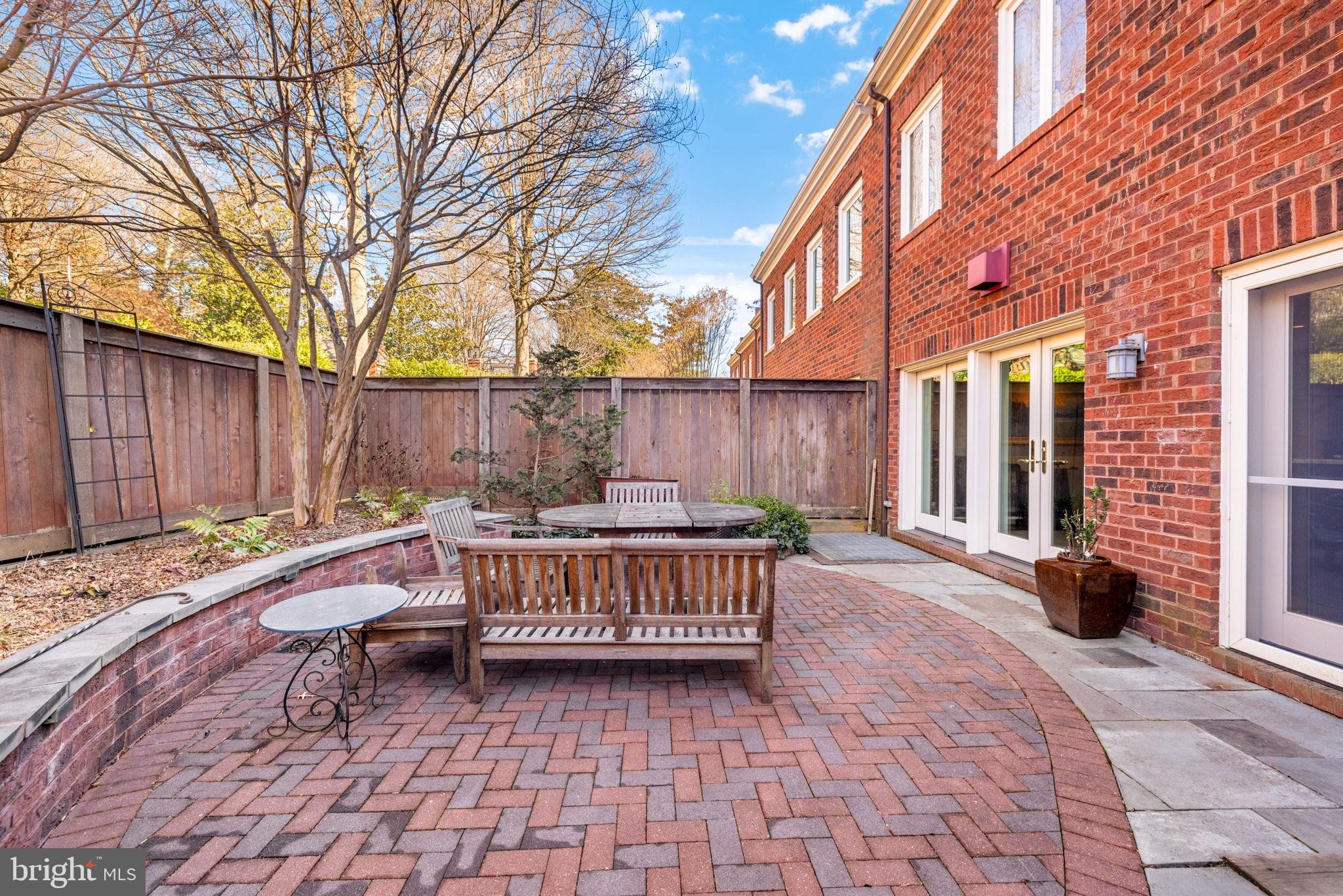 3988 Georgetown Court Northwest Washington, DC 20007 - Photo 36 of 38 a view of backyard with a patio and outdoor seating