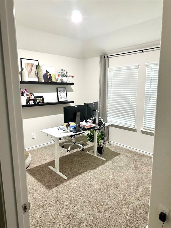324 Revolution Road Fate, TX 75189 - Photo 5 of 15 Carpeted interior room with two windows featuring horizontal blinds
