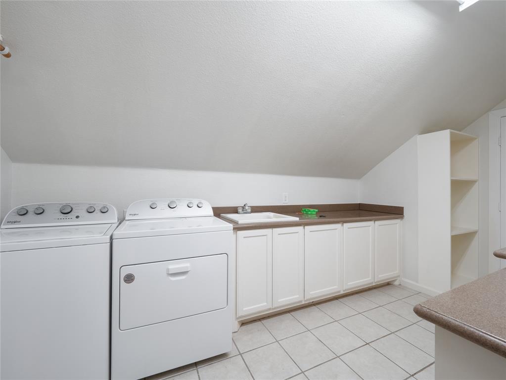 7321 North State Highway Blue Ridge, TX 75424 - Photo 24 of 30 Laundry area with light tile patterned floors, cabinet space, a textured ceiling, and washing machine and dryer