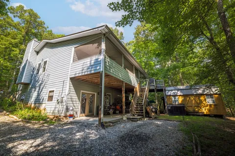 a view of a car park in front of a house