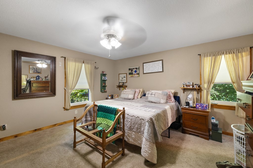 77 Chosen Ridge Morganton, GA 30560 - Photo 23 of 37 a bedroom with a bed and a window