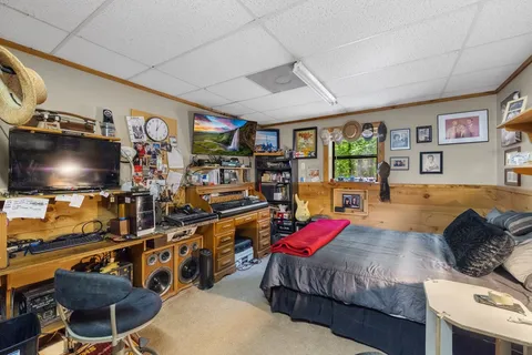 a living room with lots of furniture and a flat screen tv