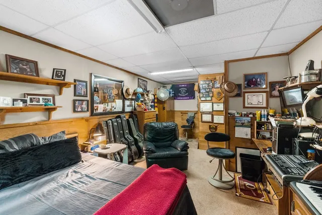 a view of a livingroom with workspace and a couch