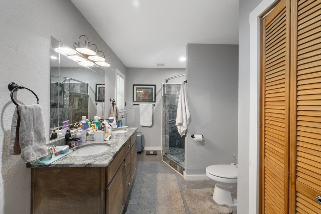 77 Chosen Ridge Morganton, GA 30560 - Photo 29 of 37 a bathroom with a sink vanity mirror and toilet