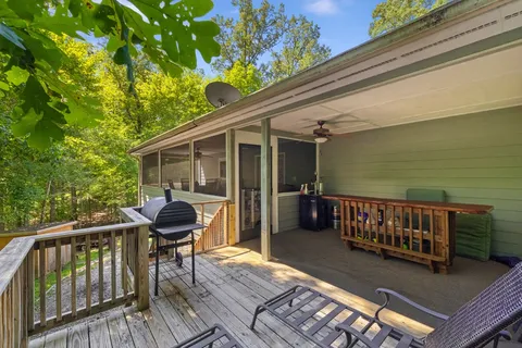 a view of a deck with wooden floor and seating space