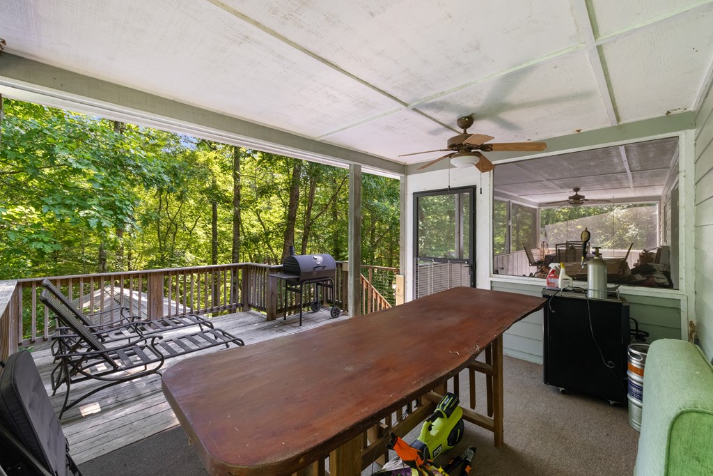 77 Chosen Ridge Morganton, GA 30560 - Photo 9 of 37 a view of a patio with a table chairs and a backyard