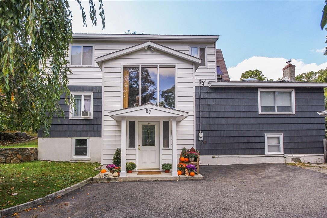 87 Hillair Road Lake Peekskill, NY 10537 - Photo 1 of 1 a front view of a house with a yard and garage