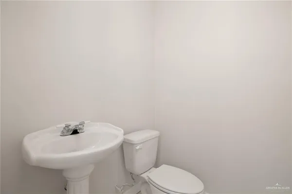 a view of an house with backyard space and balcony