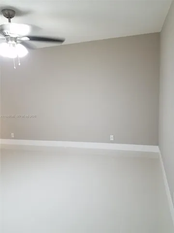 an empty room with a empty space and a window