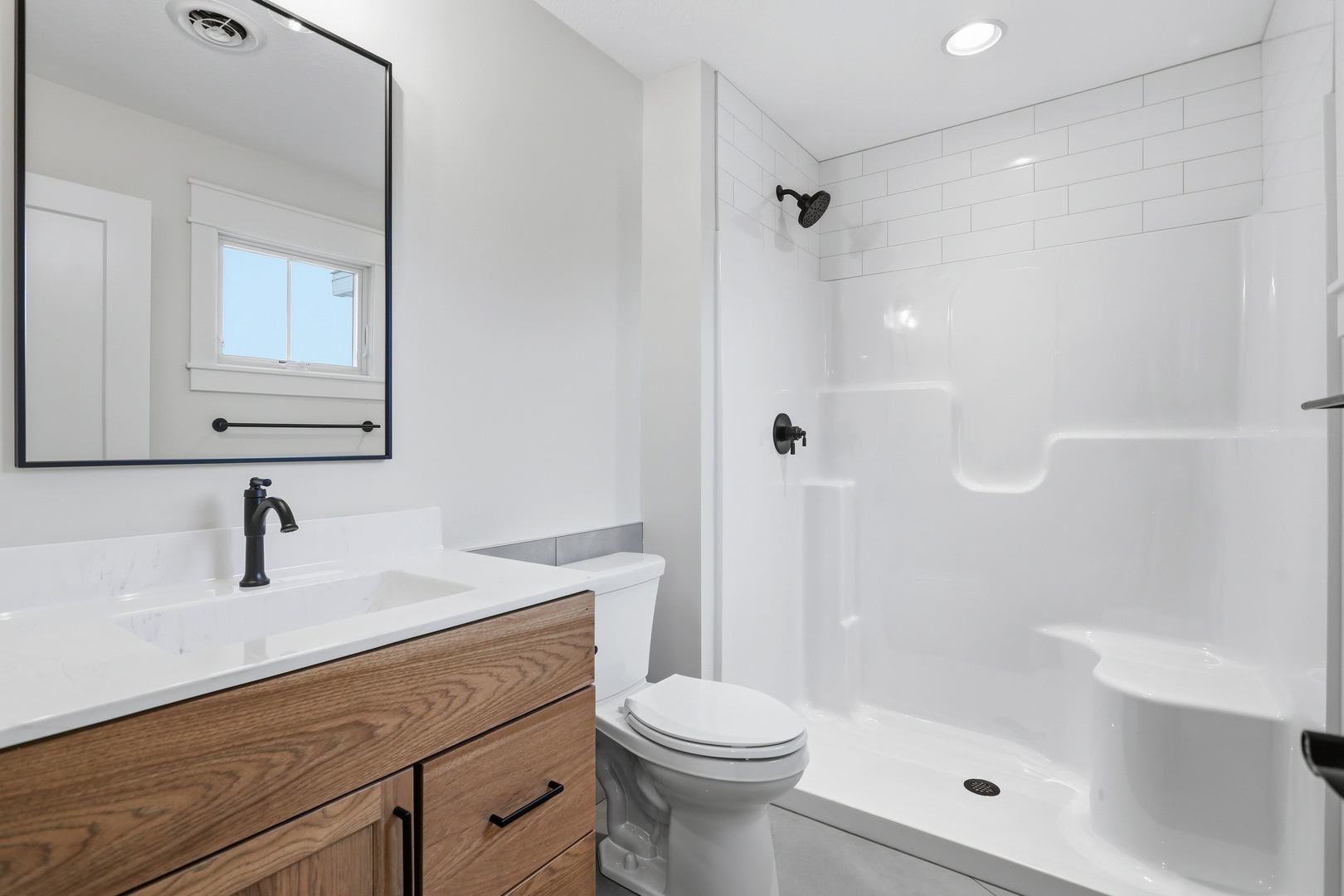 6928 Wilderness Pointe Bettendorf, IA 52722 - Photo 43 of 48 a bathroom with a sink a toilet and shower