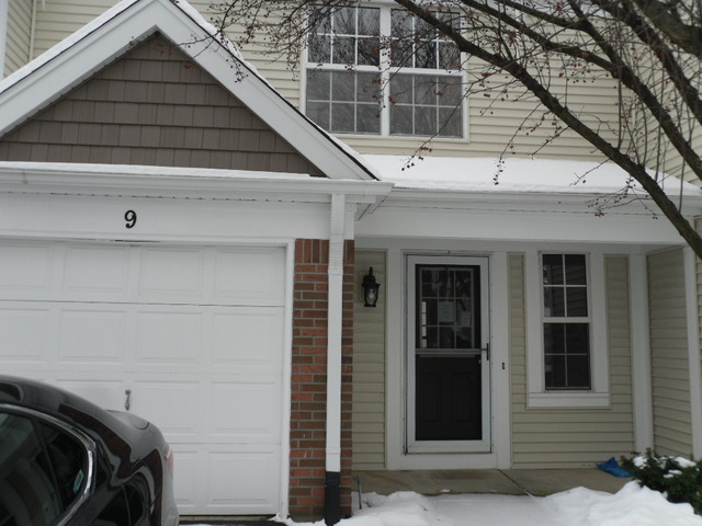 9 North Oltendorf Road Streamwood, IL 60107 - Photo 1 of 14 a view of a house with a door and wooden walls