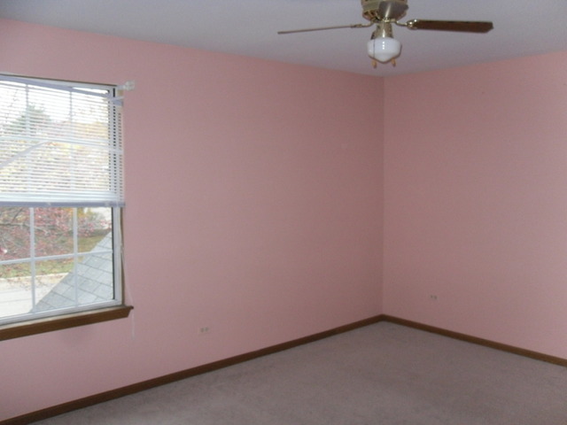 9 North Oltendorf Road Streamwood, IL 60107 - Photo 9 of 14 a view of a small space with wooden floor and a window