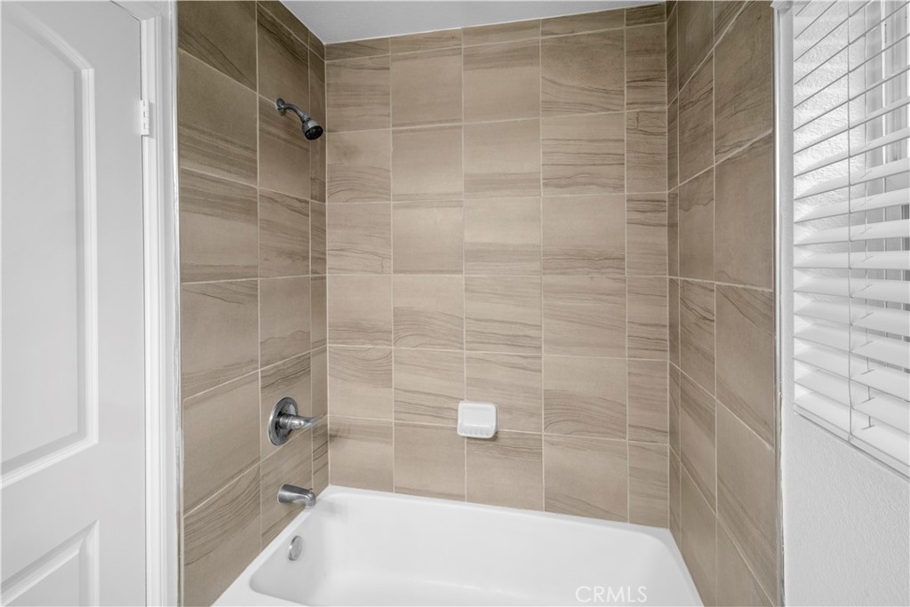 4617 Alekona Ct. Cypress, CA 90630 - Photo 11 of 35 a bathroom with a bathtub