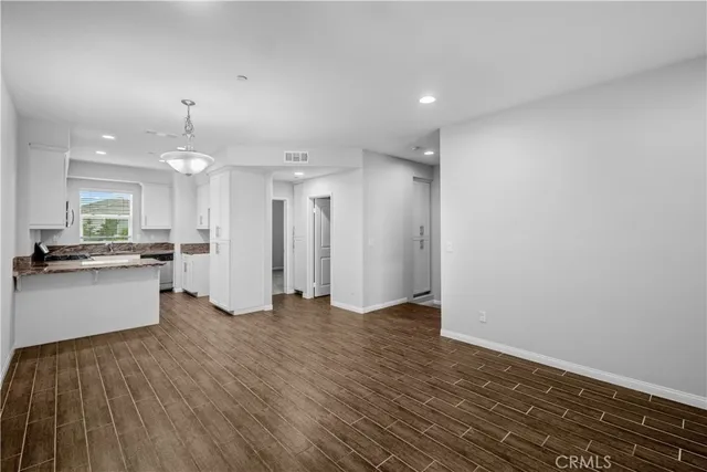 a view of kitchen with wooden floor