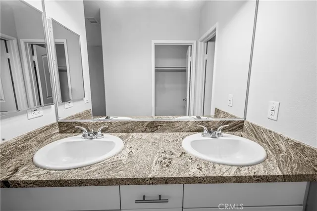 a bathroom with sinks granite granite and a sink