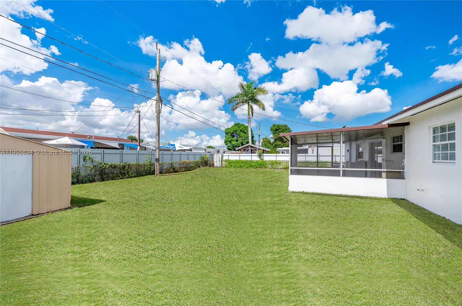5420 Northwest 182nd Street Miami Gardens, FL 33055 - Photo 12 of 35 a view of a big room with a big yard