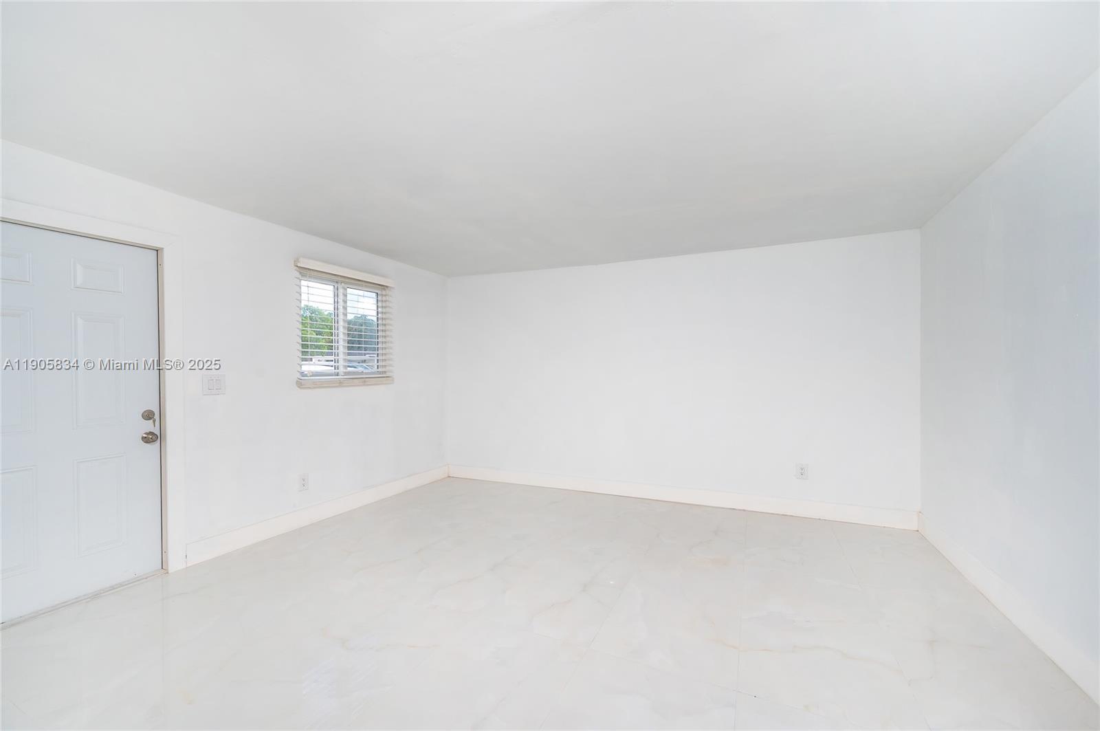 5420 Northwest 182nd Street Miami Gardens, FL 33055 - Photo 17 of 35 an empty room with a window