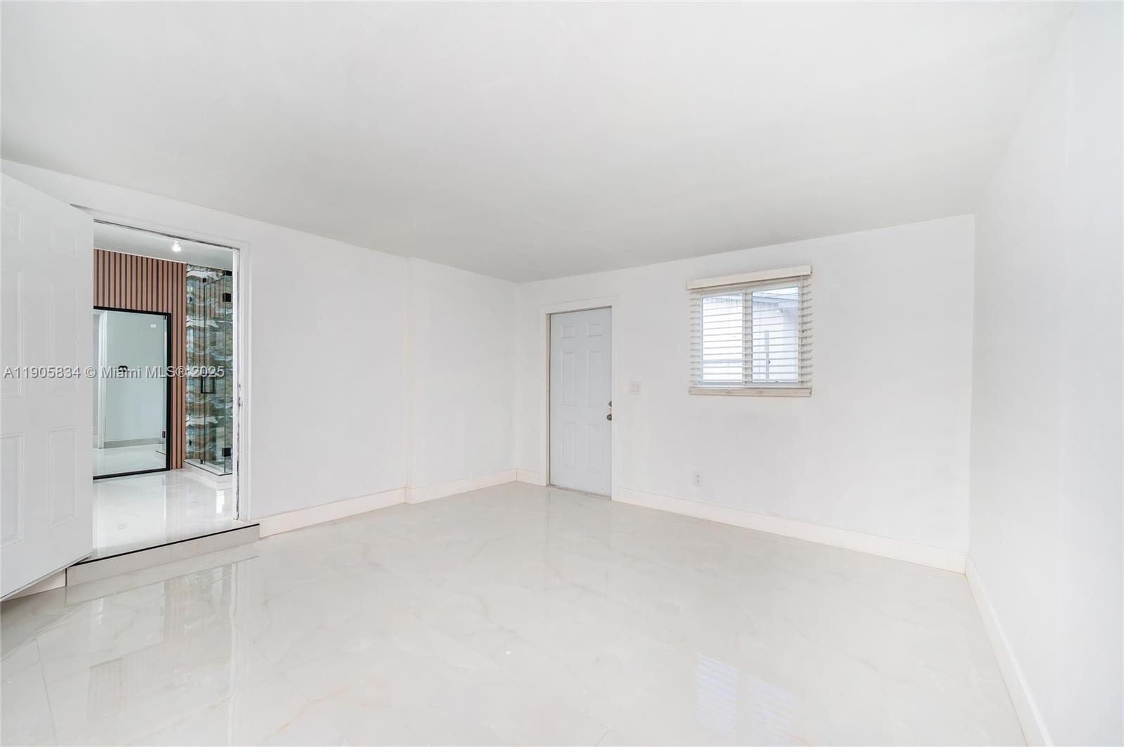 5420 Northwest 182nd Street Miami Gardens, FL 33055 - Photo 18 of 35 an empty room with windows