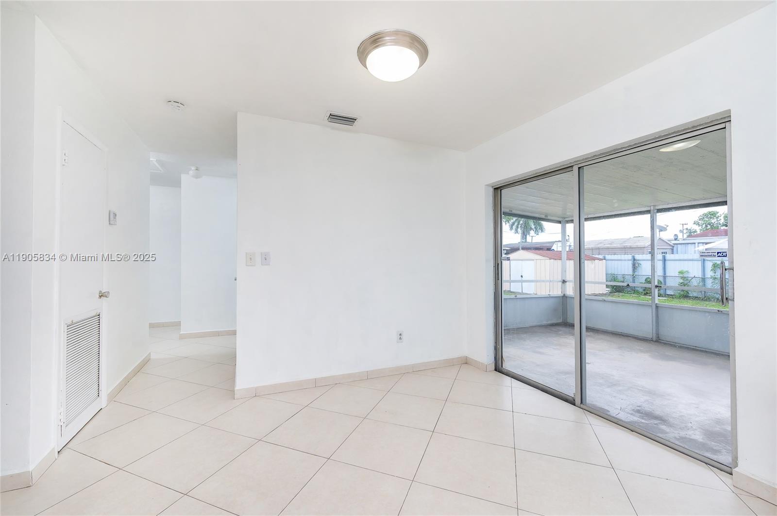 5420 Northwest 182nd Street Miami Gardens, FL 33055 - Photo 23 of 35 a view of an empty room with a window