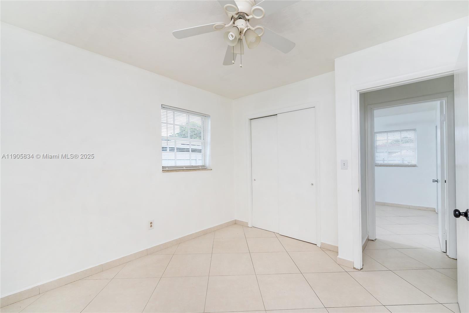 5420 Northwest 182nd Street Miami Gardens, FL 33055 - Photo 33 of 35 a view of an empty room with chandelier fan