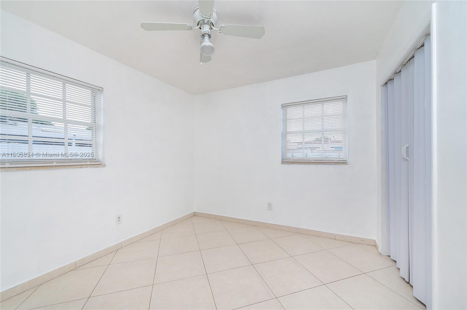 5420 Northwest 182nd Street Miami Gardens, FL 33055 - Photo 34 of 35 a view of an empty room with a window