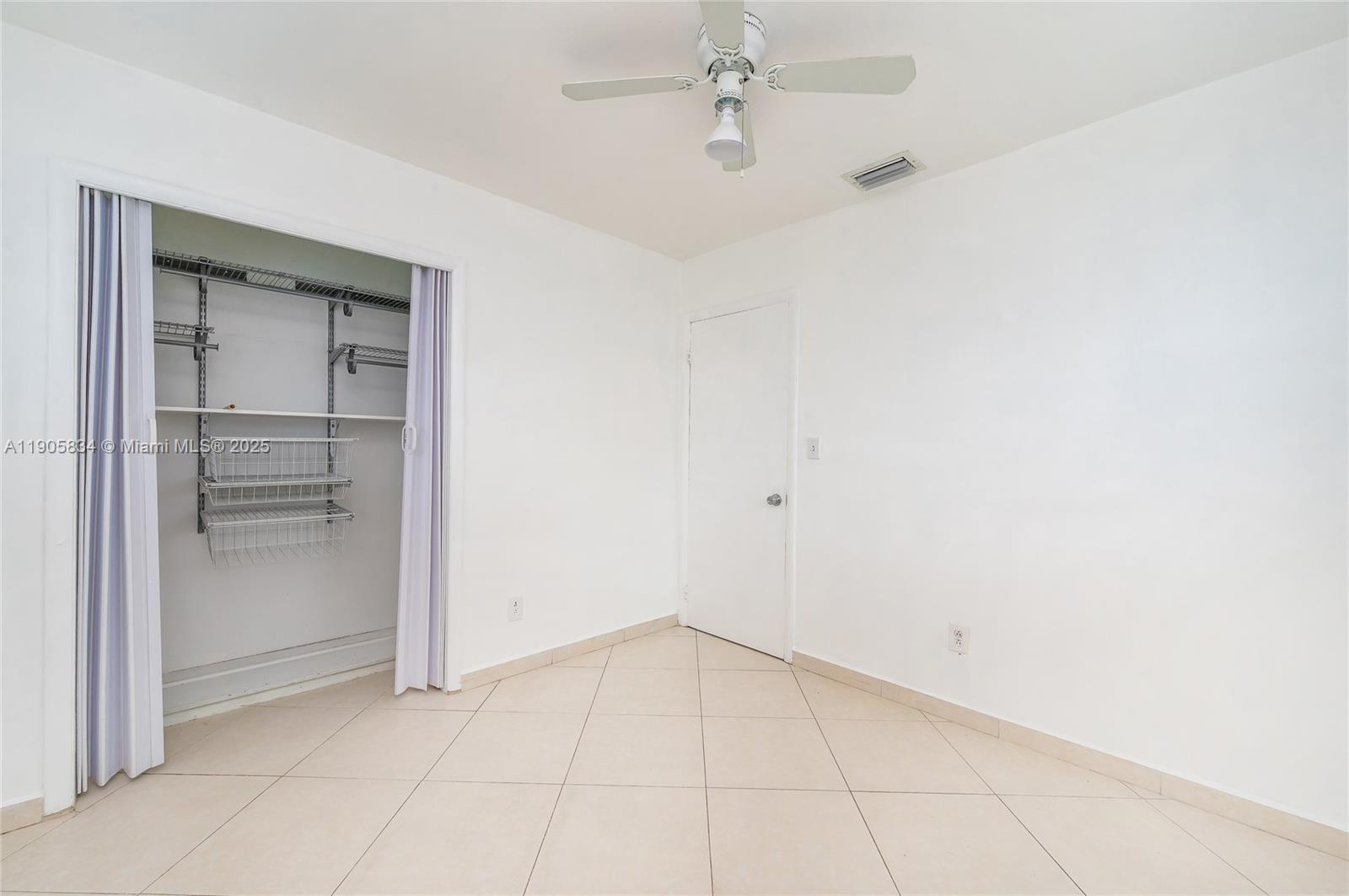5420 Northwest 182nd Street Miami Gardens, FL 33055 - Photo 35 of 35 an empty room with a empty space