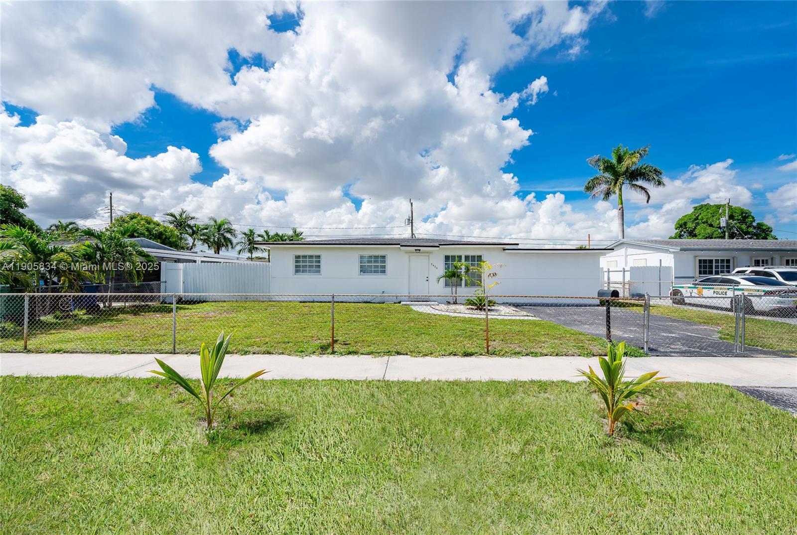 5420 Northwest 182nd Street Miami Gardens, FL 33055 - Photo 5 of 35 a view of a swimming pool with a yard