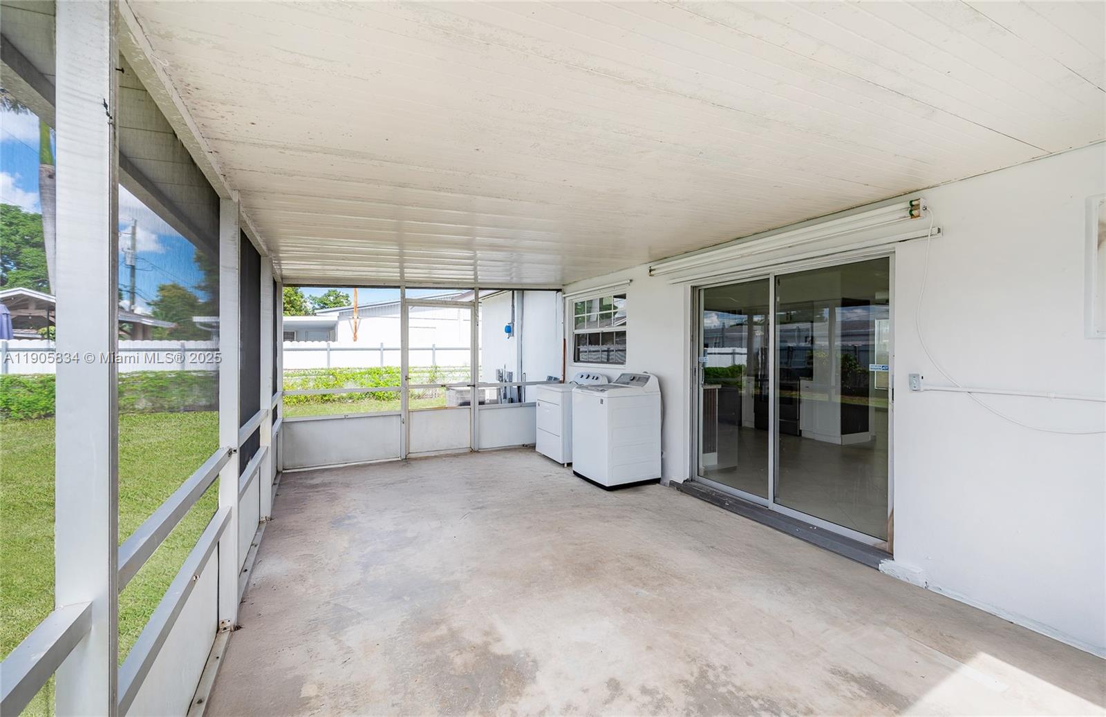 5420 Northwest 182nd Street Miami Gardens, FL 33055 - Photo 7 of 35 a view of an empty room with a sliding door