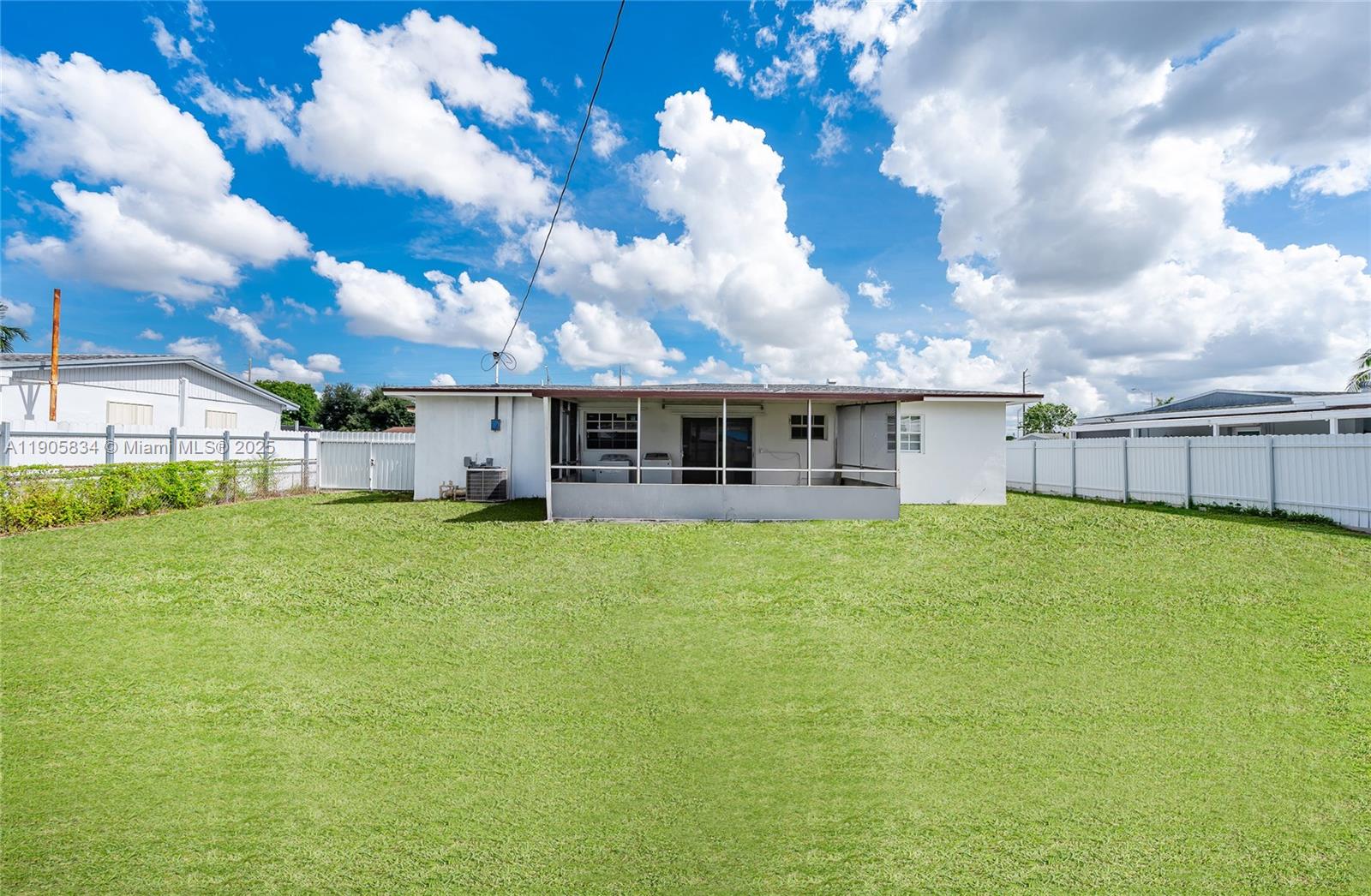 5420 Northwest 182nd Street Miami Gardens, FL 33055 - Photo 10 of 35 a view of a house with a backyard