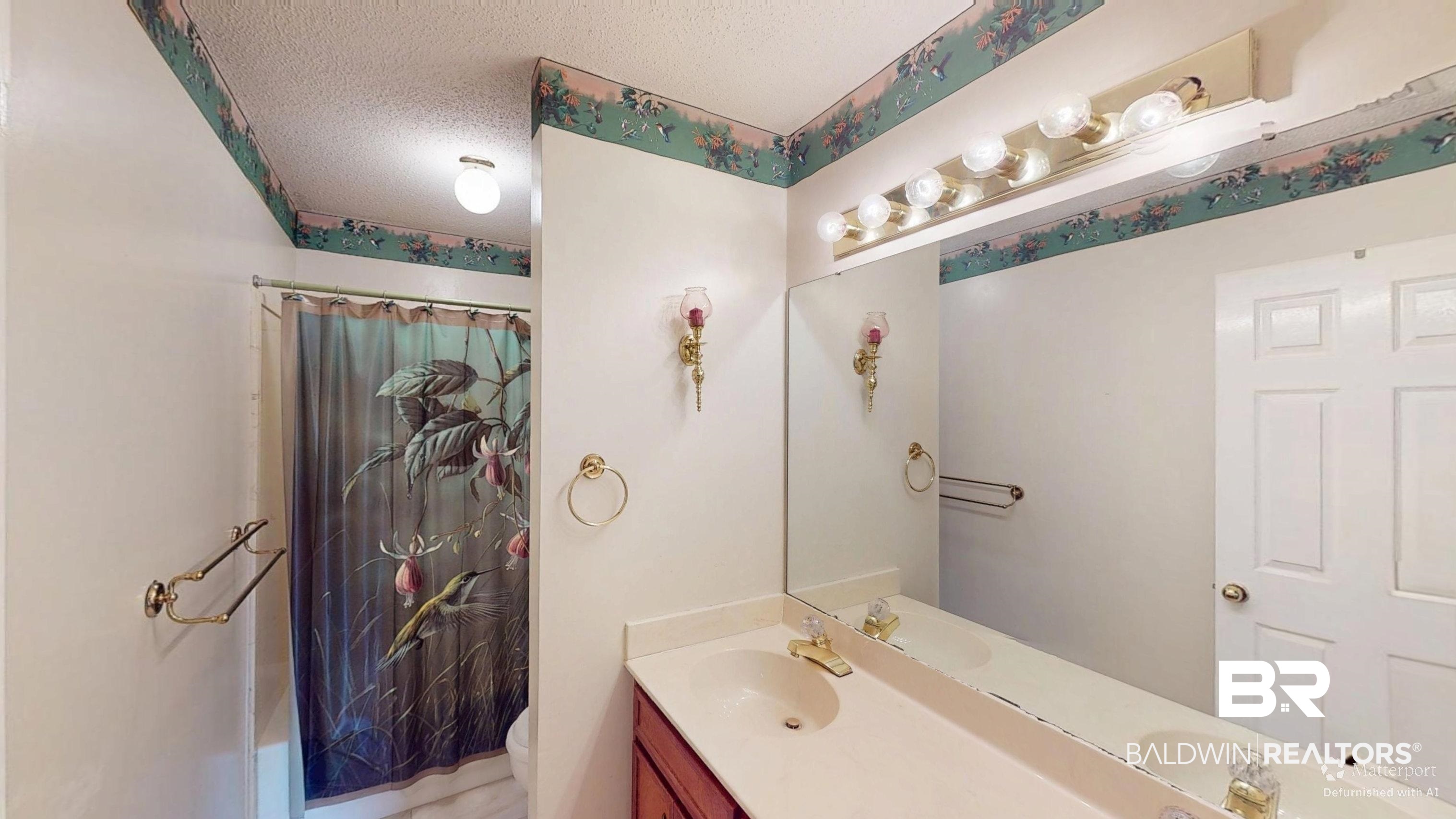 7310 Cheryl Court Mobile, AL 36695 - Photo 20 of 23 Full bathroom with double vanity off the wide hall.