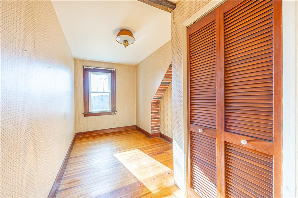 422 New Castle Road Butler, PA 16001 - Photo 19 of 27 a view of a hallway with windows