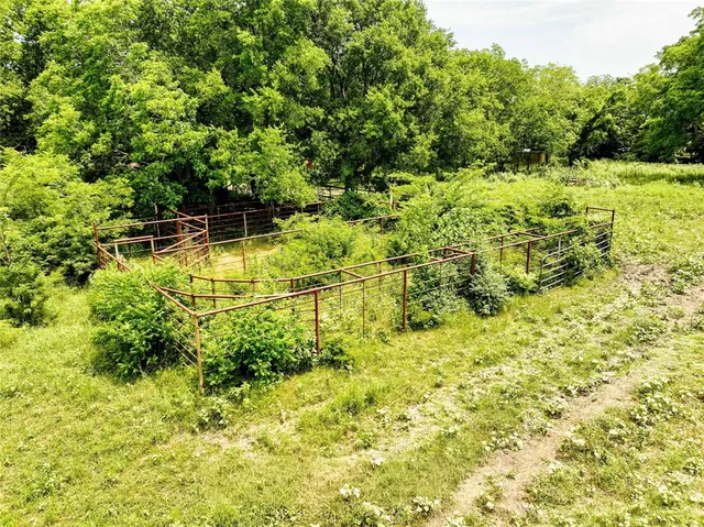 a view of a yard with swimming pool
