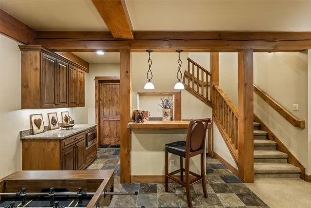 a kitchen with a sink and a stove top oven