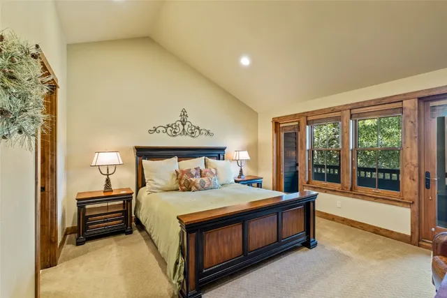 a bedroom with a bed and a night stand