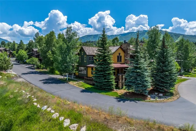 a view of a house with a flower garden