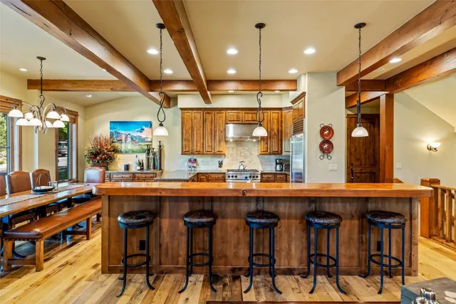 a kitchen with a table and chairs in it